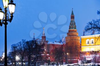 snow in Moscow - Kremlin tower and Alexander Garden in winter snowing evening