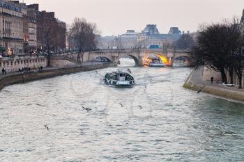 evening panorama of Seine river and Pont Neuf in Paris