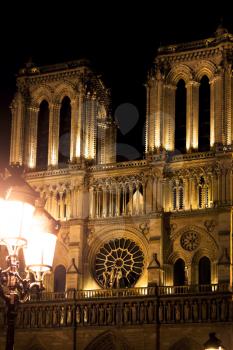 facade of Notre-Dame in Paris at night
