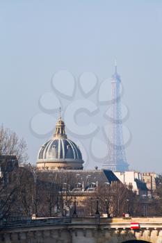 view of Eiffel Tower and French Academy through Pont Neuf in Paris