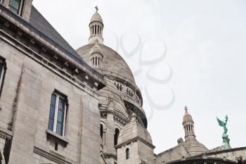 side view of Basilica Sacre Coeur in Paris, France