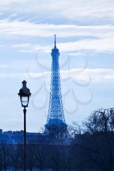 urban lantern and eiffel tower in Paris on blue sunset