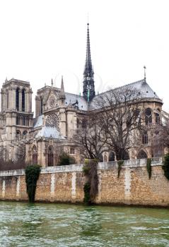 cathedral Notre-Dame de Paris and Seine River in overcast day