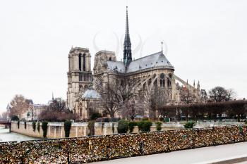 Bridge de l Archeveche with love padlocks and cathedral Notre Dame de Paris