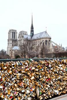 Pont de l Archeveche with love padlocks and cathedral Notre Dame de Paris