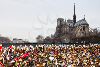 Pont de l Archeveche with love padlocks and cathedral Notre Dame de Paris