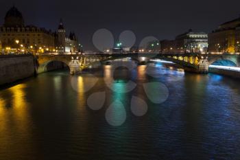 Panorama of Seine with pont notre dame and pont au change in Paris at night