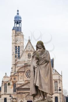 statue of Pierre Corneille and tower of Church of Saint-Etienne-du-Mont in Paris