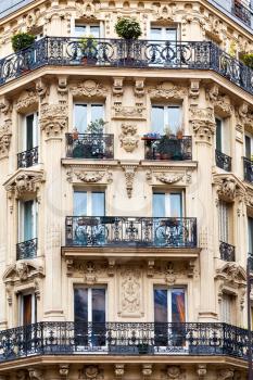 corner of of typical house with balcony in Paris, France
