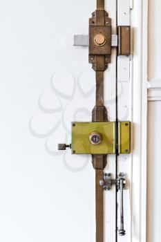 steel door locks on white door