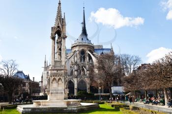 Notre-dame de paris and Fountain of the Virgin from Square Jean XXIII in Paris