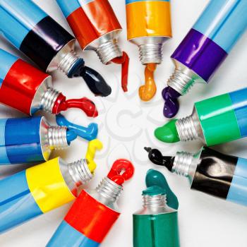 many multicolored tubes with squeezed watercolors