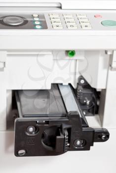 inserting of toner cartridge in office copier close up