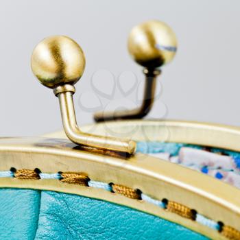 open brass clutches of handbag close up