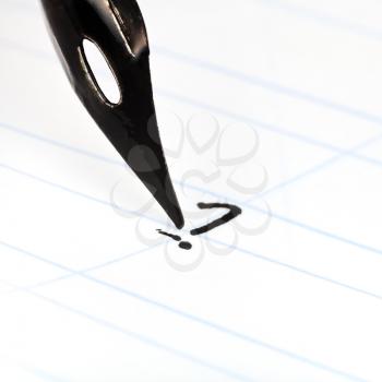 dot the I with nib of drawing pen by black ink in lined notebook