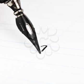 dot letter I with metal nib of drawing pen by black ink