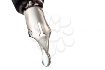 transparent liquid drop dripping from the nib of pen close up isolated on white background