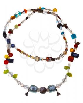 multi-colored necklace from amethyst, lazurite, onyx, sodalite, glass beads and figurines of Buddha isolated on white background