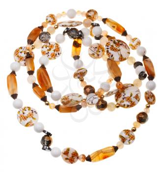 necklace from beads of brown agate stones, hematite mineral, decorated mother-of-pearl, balls of marble and natural quartz isolated on white background