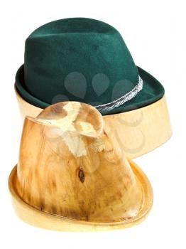 bavarian felt hat on linden wooden hat block and additional hat block isolated on white background