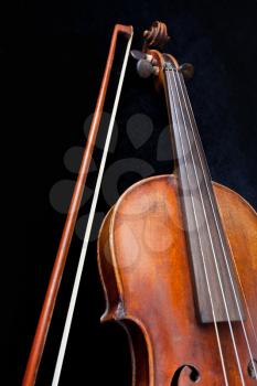 violin and bow on black background close up