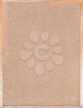 blank cork board in wood frame