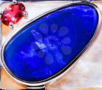 big blue opal and small pink tourmaline close up