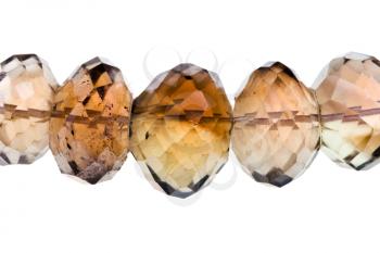 string of smoky quartz beads close up isolated on white background