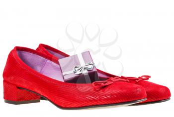 pairs of red women shoes with small gift box isolated on white background