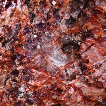 macro view background from pink mineral with crystalline inclusions