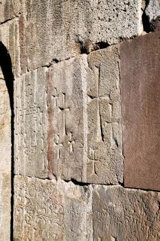 ancient carved crosses on walls of medieval Tatev Monastery in Armenia