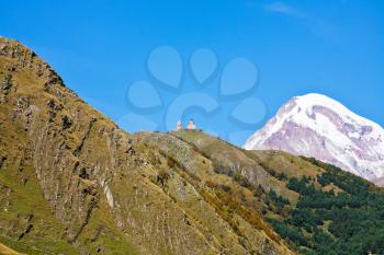 Gergeti Trinity Church and Mount Kazbek in Caucasus Mountains in Georgia