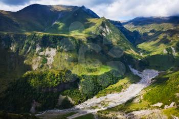 above view of Aragvi river valley near Cross Pass in Caucasus mountains in Georgia