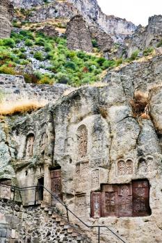 steps, chapel and khachkar carved cross-stones in medieval geghard monastery in Armenia