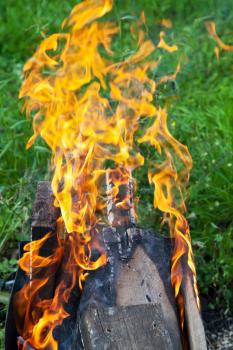 flames of burning boards in outdoor brazier