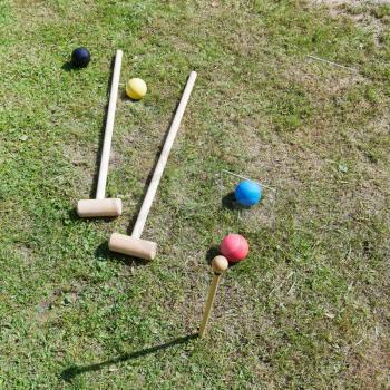 croquet equipment for game of croquet on green lawn
