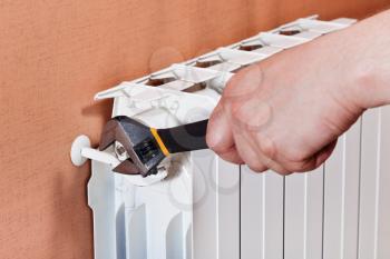 regulation of heating radiator by adjustable wrench