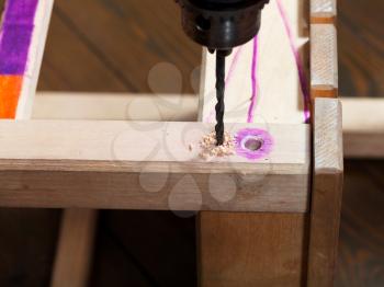repairing of wooden chair with drill