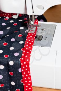 sewing dress on sewing machine