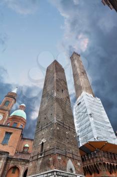 Two towers under dramatic sky in Bologna, Italy