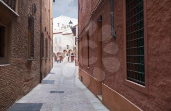 side street in medieval town of Bologna before rain, Italy