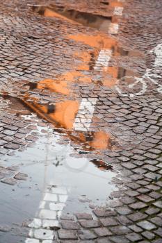 rainy autumn puddle in Bologna, Italy