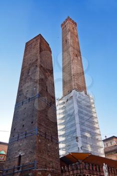 Two towers under blue sky in Bologna, Italy