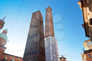 Two towers - symbol of city under blue sky in Bologna, Italy