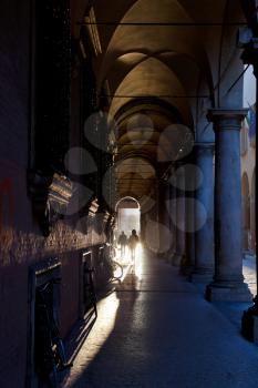 arcade on Via Zamboni in Bologna at autumn afternoon, Italy