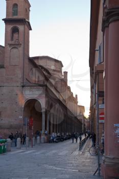 ancient urban fortified circle wall of Torresotti (cerchia dei torresotti) and view on church San Giacomo Maggiore from Via Zamboni in Bologna, Italy