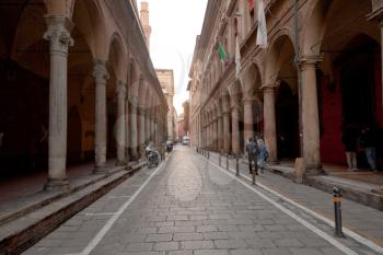 Arcade on via Zamboni in Bologna in autumn afternoon, Italy