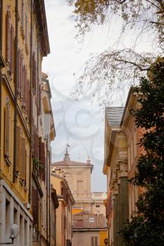 medieval street in historical district of Modena, Italy in autumn