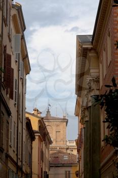 medieval street in historical district of Modena, Italy in autumn