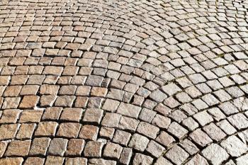 medieval cobble stone pavement on piazza trento trieste, Ferrara, Italy